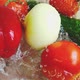 Tomato, cucumber and sweet red pepper fall into a glass bowl of water. Slow motion. - VideoHive Item for Sale