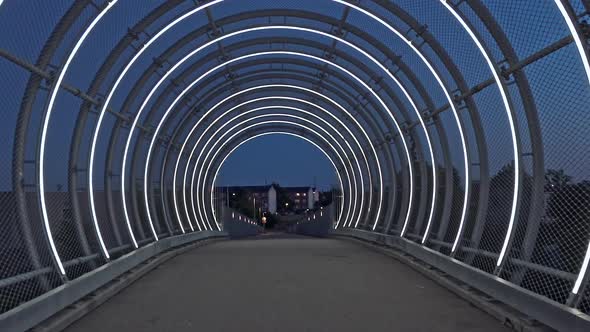 Passing Through An Open Tunnel With Lights at the End of the Bridge alt