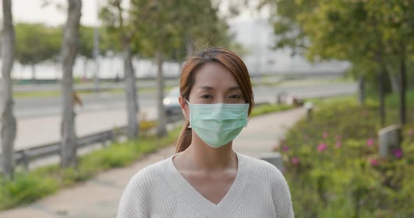 Woman wearing medical face mask street