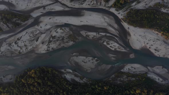 Aerial view Laba river flood forest at dawn, autumn, natural water earth patterns, Caucasus Russia alt