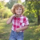 Portrait of Charming Redhead Caucasian Little Boy Standing in Park on Sunny Day Looking at Camera - VideoHive Item for Sale