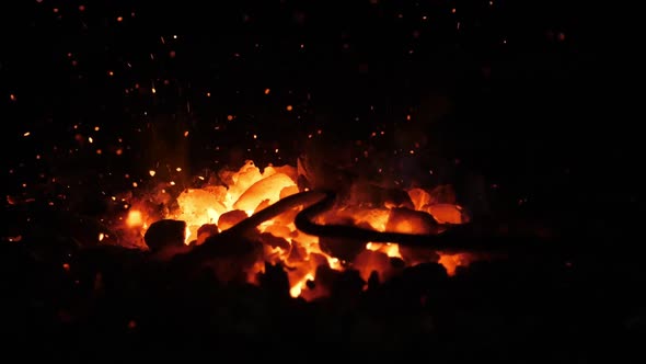 Orange Furnace Fire with Low Forks in an Old Ukrainian Blacksmith Workshop 