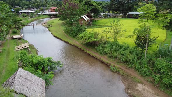 Aerial view of the river and paddy filed in rural mountain village by drone