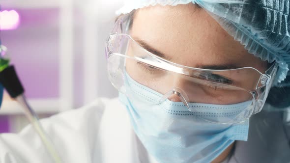 Medical Scientist Inspecting Microgreens Wearing Protective Unform Working in Laboratory alt