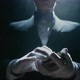 Closeup of a Suited Magician&#39;s Hands Performing Sleight of Hand Card Tricks - VideoHive Item for Sale