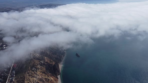 High Above the Thick Fog Like Beautiful Ocean of Clouds at Sunrise alt