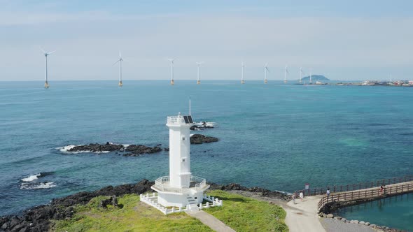 A drone view flying towards a wind turbine. Jeju Island. Jeju island