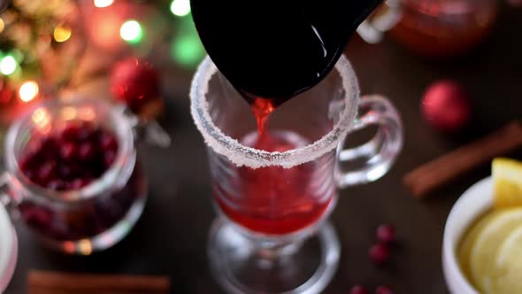 Pouring mulled wine into the Irish glass alt