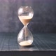 Hourglass on Table Sand Flowing Through the Bulb of Sandglass - VideoHive Item for Sale