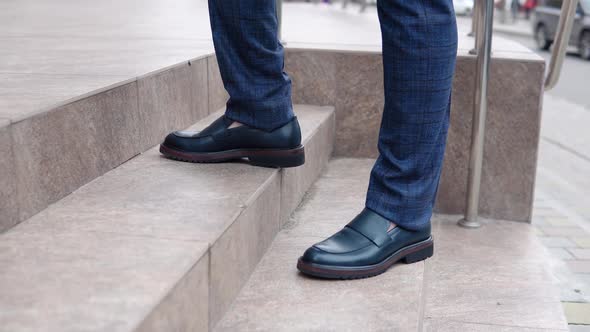 A Man Walks Down the Street in New Shoes alt