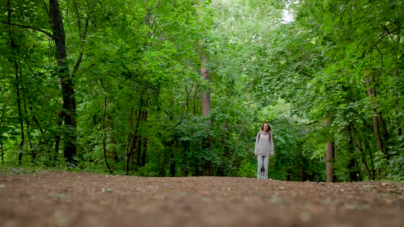 A Girl in Jeans and a Hoodie Rides on a Gyrocopter alt