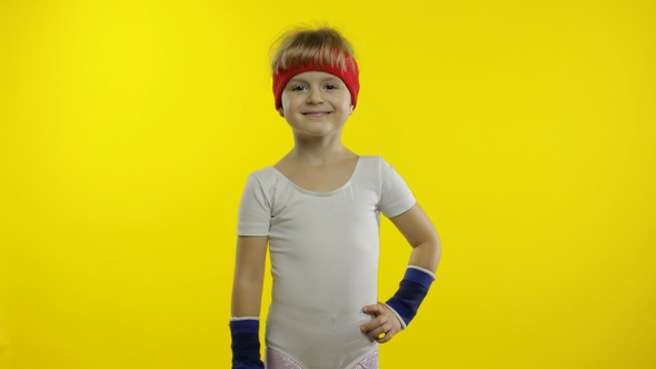 Young Child in Sportswear Making Fitness Gymnast Home Exercises. Workout for Kids. Sporty Girl alt