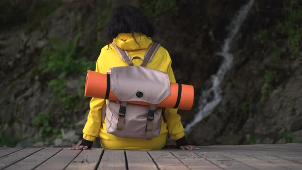 Girl Traveler Contemplating the Waterfall Scene alt