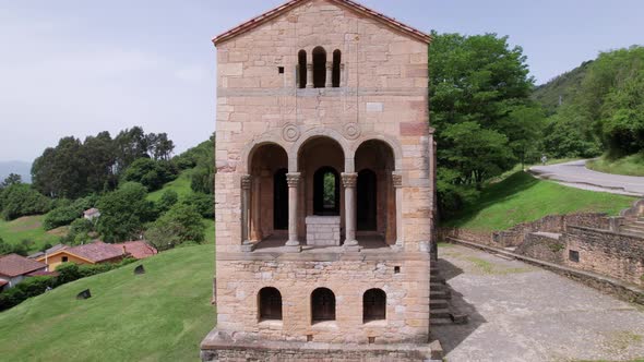 Front aerial view of beautiful old middle aged church in the outdoors of Asturias, north Spain. alt