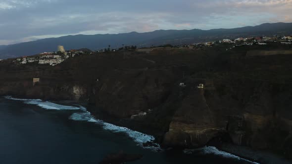 Aerial view of the beautiful cliffs of Playa Castro during the evening, Tenerife alt