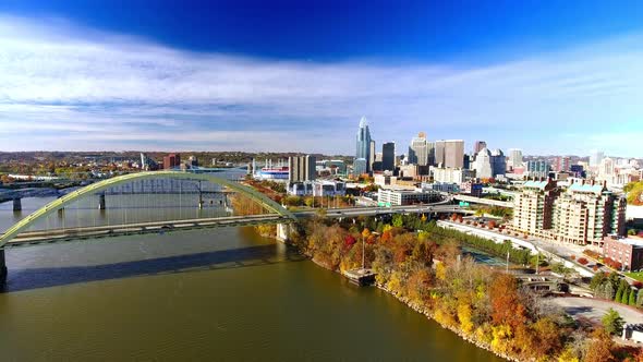 Revealing drone footage of downtown Cincinnati Ohio with busy traffic on the highway alt