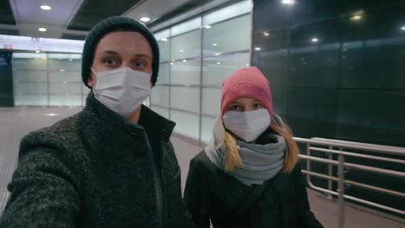 Couple in Surgical Masks in Make Selfie in Airport During Coronavirus Pandemic