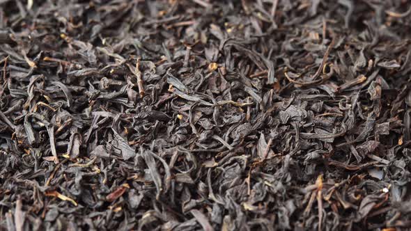 Black Loose Leaf Tea Spinning Close Up on Plate Background for a Cafe or Restaurant Black Tea Tea alt