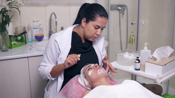 Professional Skin Care for Young Woman in Spa Salon alt