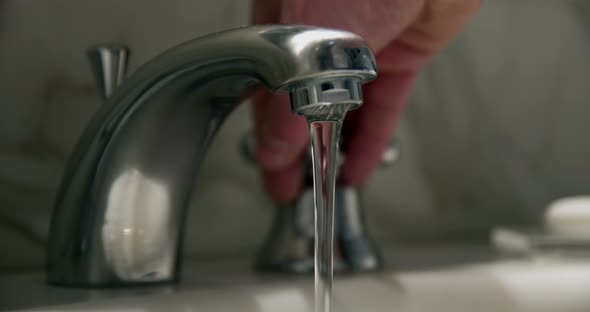 Hotel faucet in slowmotion