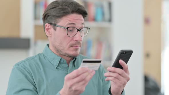 Middle Aged Man with Successful Online Shopping on Smartphone alt