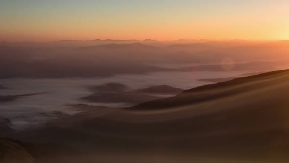 Time Lapse Fog Rolling Over Mountain Valley alt