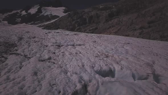 Low flight above mountain glacier