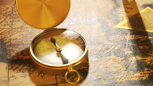 Bermuda triangle marked with golden ink on a vintage map. Compass malfunction. alt