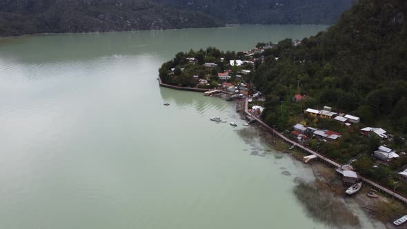 Aerial view of Caleta Tortel, an amazing village full of wooden catwalks in south Chile. alt