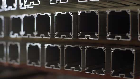 Warehouse of Metal Profiles. Aluminium Production Line Factory Warehouse Stack of Profiles. Heavy alt