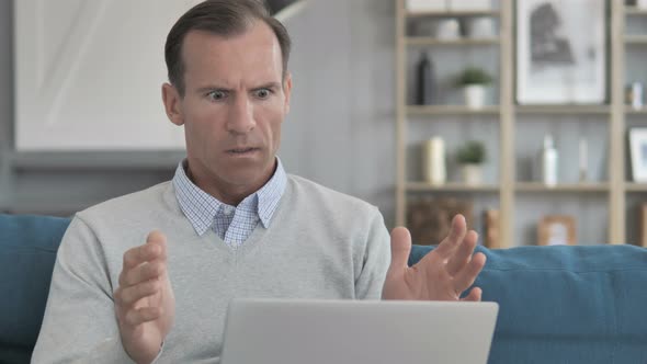 Astonished Middle Aged Man in shock by Results alt