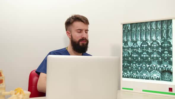 Physiotherapist Writes Down Patient's Symptoms Associated with Back Arm Pain alt