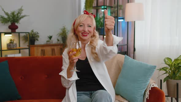 Joyful Senior Old Grandmother Hold Glass of Champagne Cheering Drinking Celebrating Success Win alt
