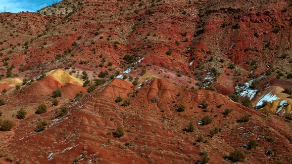 Aerial view of orange and yellow rock formations in vermillion cliffs utah outside kanab. alt