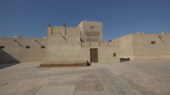 Stone building with Arabic letters alt