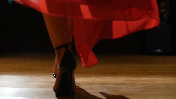 Female Model In Heels Walking On Hardwood Floor In Red Dress
