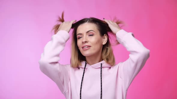 Young Caucasian Woman on Pink Color Background