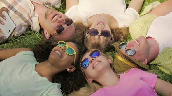 Best Friends Having Good Rest Lying on Grass Joking and Laughing Friendship alt