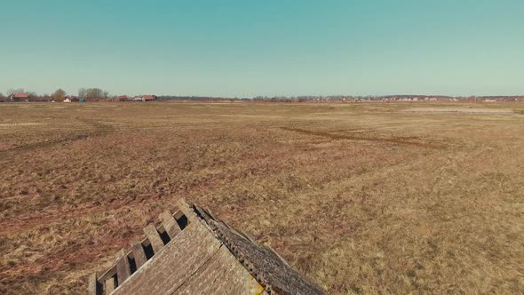Old abandoned house standing in the field