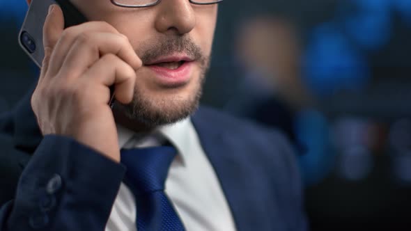 Close Up Bearded Male Mouth Talking Smartphone Discussing Job at Hi Tech Office Workspace alt