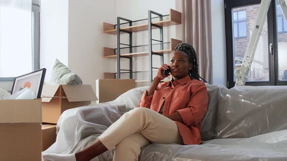 Happy Woman Calling on Phone Moving to New Home