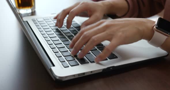 Woman work on notebook computer alt