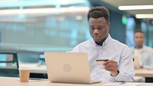 Online Payment Failure on Laptop By African Businessman alt