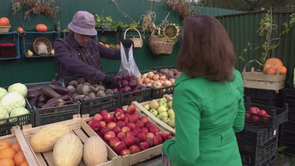 Buying Onions at the Market. 2 Shots. alt