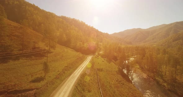 Low Altitude Flight Over Fresh Fast Mountain River with Rocks at Sunny Summer Morning. alt