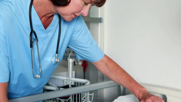 Female doctor examining a patient alt