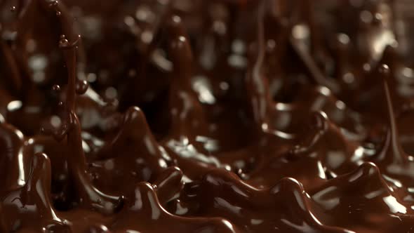 Super Slow Motion Detail Shot of Splashing Melted Chocolate at 1000 Fps alt