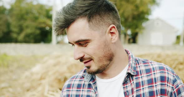 Man Farmer Working in the Field Inspects the Crop Wheat Germ Natural a Farming alt