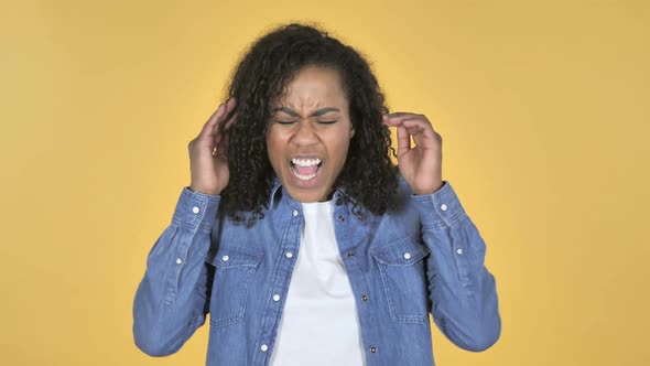 Screaming Angry African Girl Isolated on Yellow Background alt