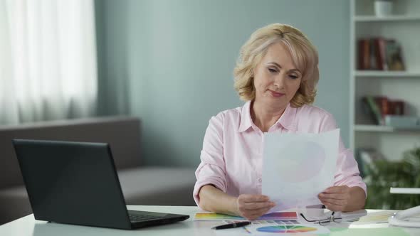 Experienced Designer Selecting Color Scheme for Arranging Her Country House alt